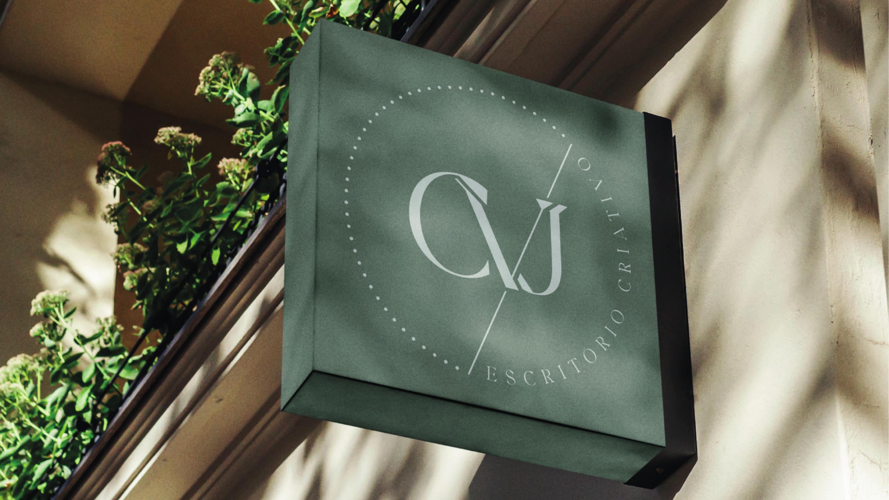 Monogram seal application in gold on a soft neutral surface