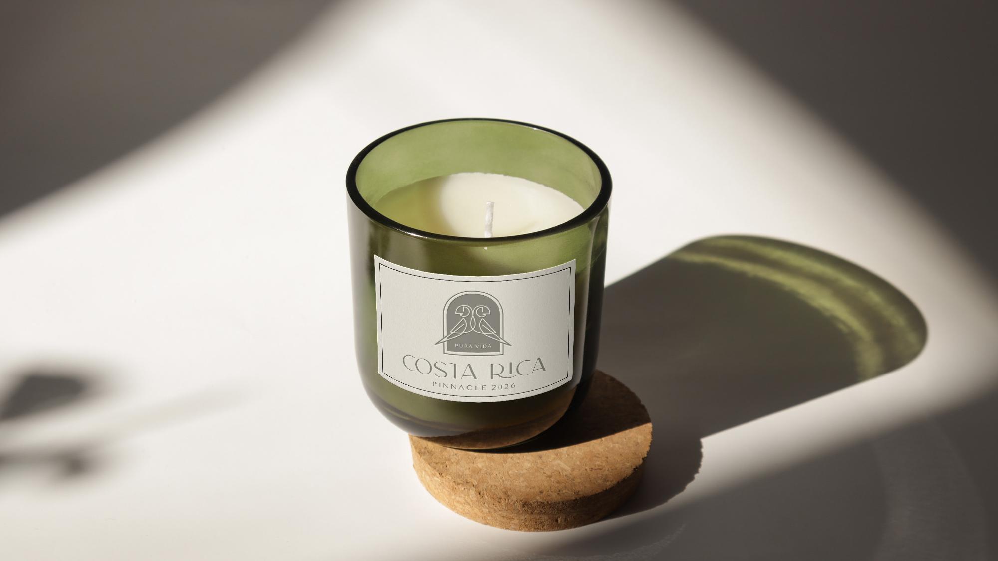 Aromatic candle labeled with Costa Rica Pinnacle 2026