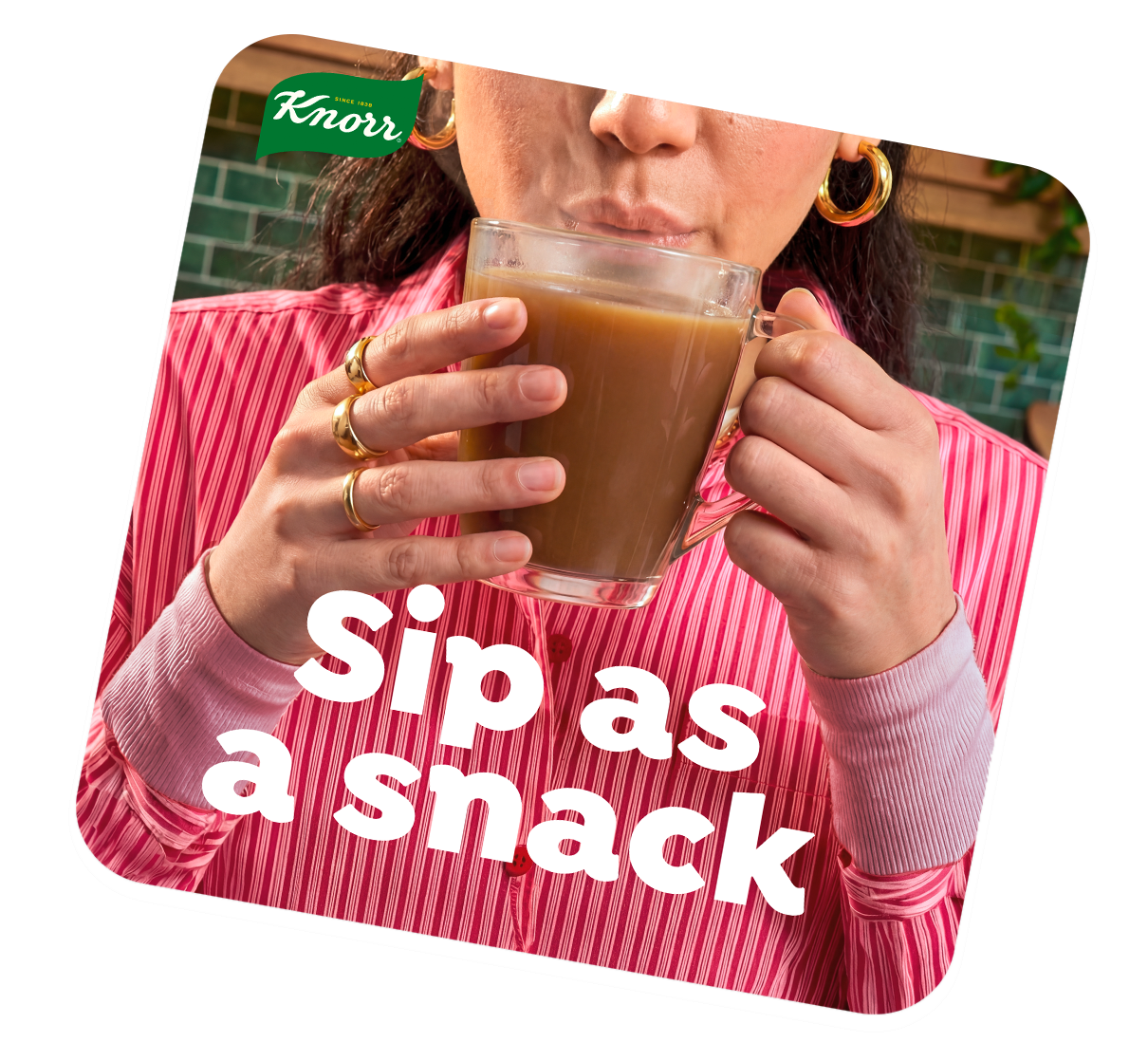 Broth served in a glass mug, sipped as a snack